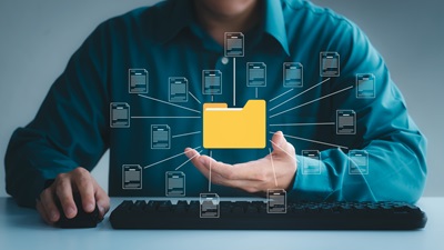 Document management system concept, business man holding folder and document icon software, searching and managing files online document database, for efficient archiving and company data. AdobeStock_503139662