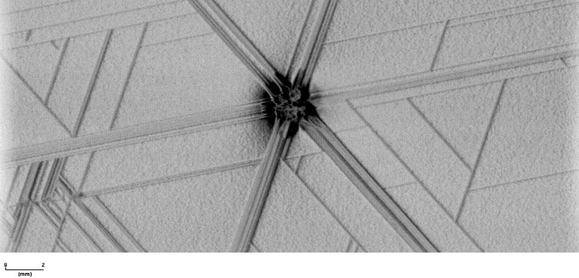 High-resolution XRDI image of defect in Si wafer with GaN epilayer showing dislocations along crystallographic planes